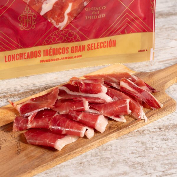 Lonchas de Jamón Ibérico Bellota 50% sobre tabla de madera del Museo del Jamón